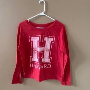 Women’s shirt with Harvard logo. Size Large